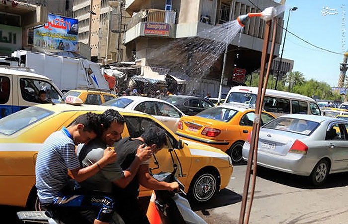 عکس: راهکار خیابانی عراقیها برای خنک شدن